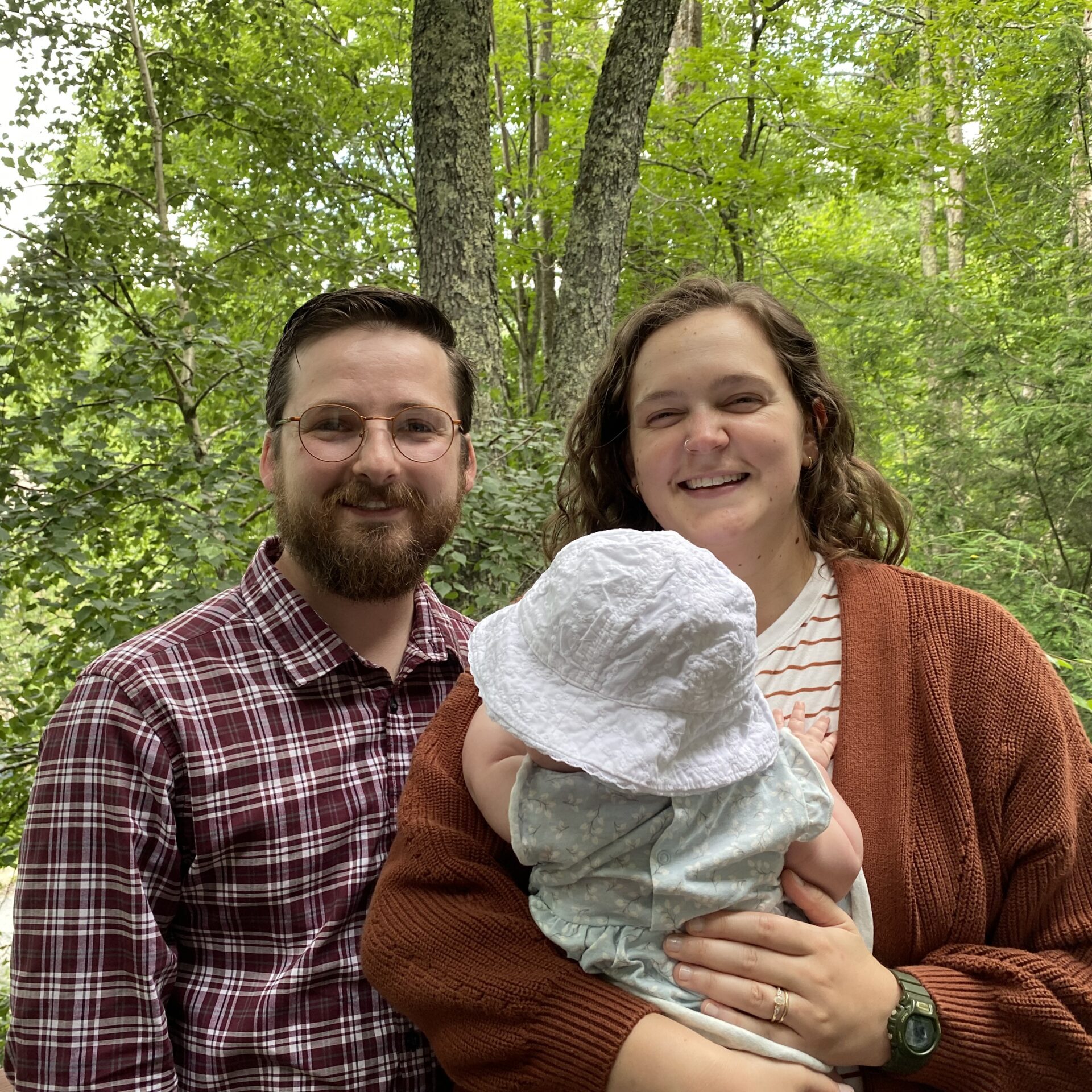 a man, woman, and baby